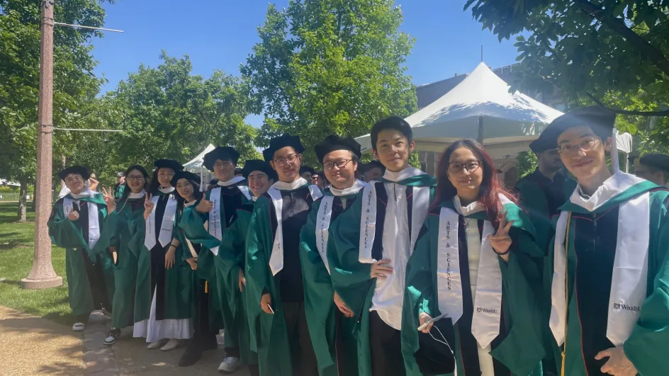 Yixun Zheng, Zihan Wang, Xiaoxuan Zhao, Lingyuan (Lyrian) Zhao, Zhaoxuan Wang, Griffin Lovato, Zekai Jin, Chufan Jiang, Ran Hu,Yutian Han, and Xinyue Ha outside Graham Chapel before the Graduate Hooding ceremony