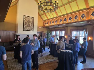 Attendees mingle in during the opening reception in Goldberg Formal Lounge
