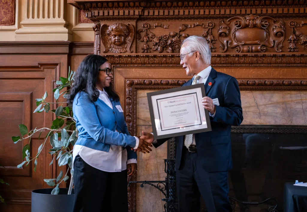 Arts & Sciences Dean Feng Sheng Hu presents Fiona Vaughn with the 2025 Outstanding Staff Service Award